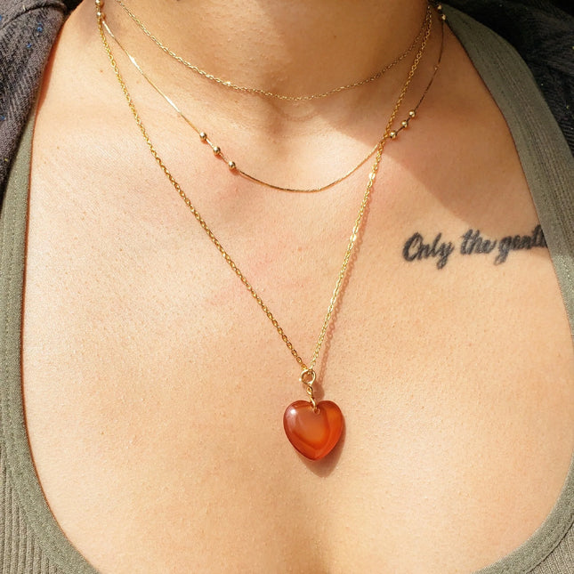 carnelian heart shaped necklace on model
